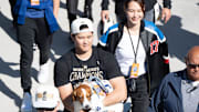 Los Angeles Dodger Shohei Ohtani, wife Mamiko Tanaka and dog Decoy arrive at Dodger Stadium for the team’s World Series Championship celebration on Nov. 1, 2024.