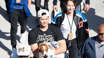 Los Angeles Dodger Shohei Ohtani, wife Mamiko Tanaka and dog Decoy arrive at Dodger Stadium for the team’s World Series Championship celebration on Nov. 1, 2024.