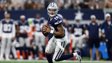 Aug 24, 2024; Arlington, Texas, USA; Dallas Cowboys quarterback Trey Lance (19) rolls out to pass against the Los Angeles Chargers in the first quarter at AT&T Stadium. Mandatory Credit: Tim Heitman-Imagn Images