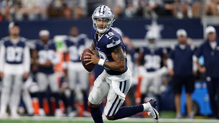 Aug 24, 2024; Arlington, Texas, USA; Dallas Cowboys quarterback Trey Lance (19) rolls out to pass against the Los Angeles Chargers in the first quarter at AT&T Stadium. Mandatory Credit: Tim Heitman-Imagn Images