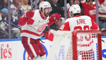 Apr 13, 2024; Toronto, Ontario, CAN; Detroit Red Wings center Dylan Larkin (71) scores the winning goal and celebrates with right wing Patrick Kane (88) against the Toronto Maple Leafs during the overtime period at Scotiabank Arena. Mandatory Credit: Nick Turchiaro-USA TODAY Sports