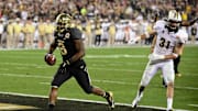 Jan 1, 2014; Glendale, AZ, USA; Baylor Bears running back Glasco Martin (8) scores a 9 yard touchdown during the second half against the UCF Knights in the Fiesta Bowl at University of Phoenix Stadium. Mandatory Credit: Matt Kartozian-Imagn Images