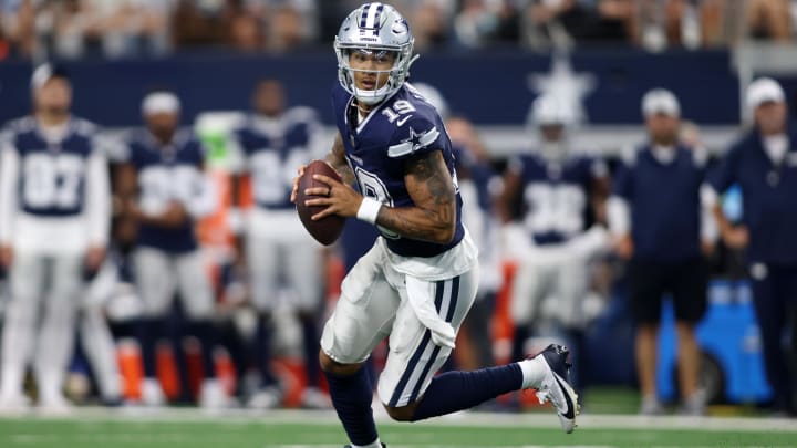 Aug 24, 2024; Arlington, Texas, USA; Dallas Cowboys quarterback Trey Lance (19) rolls out to pass against the Los Angeles Chargers in the first quarter at AT&T Stadium. 