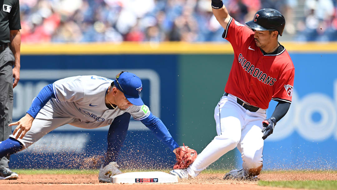 Jun 26, 2025; Cleveland, Ohio, USA; Cleveland Guardians left fielder Steven Kwan (38) slides into second with a double as Toronto Blue Jays second baseman Andres Gimenez (0) is late with the tag during the first inning at Progressive Field. Mandatory Credit: Ken Blaze-Imagn Images Jun 26, 2025; Cleveland, Ohio, USA; Cleveland Guardians left fielder Steven Kwan (38) slides into second with a double as Toronto Blue Jays second baseman Andres Gimenez (0) is late with the tag during the first inning at Progressive Field. Mandatory Credit: Ken Blaze-Imagn Images