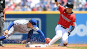 Jun 26, 2025; Cleveland, Ohio, USA; Cleveland Guardians left fielder Steven Kwan (38) slides into second with a double as Toronto Blue Jays second baseman Andres Gimenez (0) is late with the tag during the first inning at Progressive Field. Mandatory Credit: Ken Blaze-Imagn Images