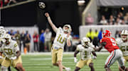 Nov 28, 2025; Atlanta, Georgia, USA; Georgia Tech Yellow Jackets quarterback Haynes King (10) throws a last chance pass to the end zone against the Georgia Bulldogs during the second half at Mercedes-Benz Stadium. Mandatory Credit: Dale Zanine-Imagn Images