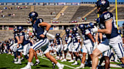 Sep 20, 2025; East Hartford, Connecticut, USA; Connecticut Huskies quarterback Joe Fagnano (2) and teammates warm up before the start of the game against the Ball State Cardinals at Pratt & Whitney Stadium at Rentschler Field. Mandatory Credit: David Butler II-Imagn Images