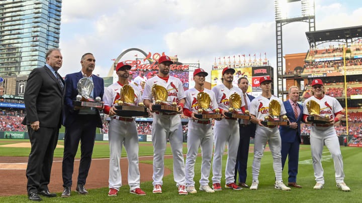 Apr 29, 2022; St. Louis, Missouri, USA;  St. Louis Cardinals center fielder Harrison Bader (48) left fielder Tyler O'Neill (27) third baseman Nolan Arenado (28) second baseman Tommy Edman (19) first baseman Paul Goldschmidt (46) pose for a photo with their 2021 gold and platinum glove  pose for a photo with their awards before a game against the Arizona Diamondbacks at Busch Stadium. Mandatory Credit: Jeff Curry-USA TODAY Sports