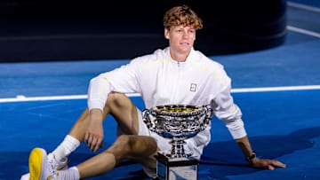 Jannik Sinner of Italy celebrates with the Australian Open title during the prize presentation at the 2025 Australian Open