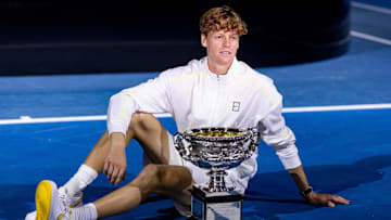 Jan 26, 2025; Melbourne, Victoria, Australia; Jannik Sinner of Italy celebrates with the Australian Open title during the prize presentation of the men's single at the 2025 Australian Open at Melbourne Park. Mandatory Credit: Mike Frey-Imagn Images