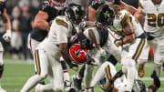 Nov 26, 2023; Atlanta, Georgia, USA; Atlanta Falcons running back Cordarrelle Patterson (84) is tackled by New Orleans Saints defensive end Cameron Jordan (94) and safety Tyrann Mathieu (32) during the first half at Mercedes-Benz Stadium. Mandatory Credit: Dale Zanine-USA TODAY Sports