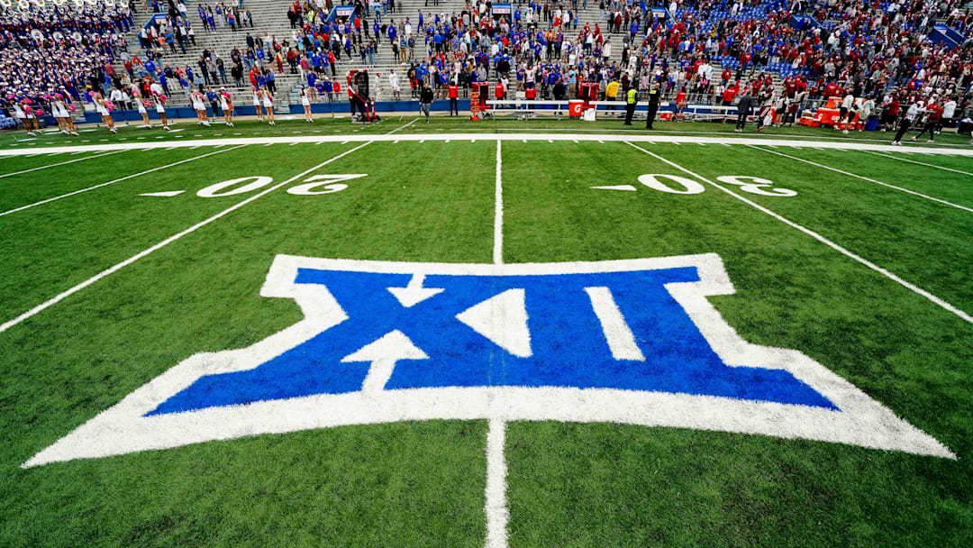 Oct 23, 2021; Lawrence, Kansas, USA; A general view of the Big 12 Conference logo on the field after the game between the Kansas Jayhawks and the Oklahoma Sooners at David Booth Kansas Memorial Stadium. Mandatory Credit: Jay Biggerstaff-Imagn Images