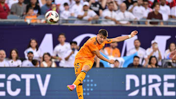 Jul 31, 2024; Chicago, IL, USA; Real Madrid midfielder Arda Guler (15) shoots the ball against AC Milan during the first half at Soldier Field. Mandatory Credit: Daniel Bartel-Imagn Images