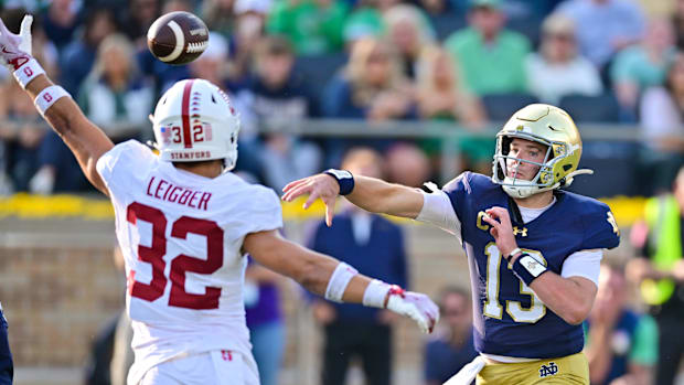 Riley Leonard throws a touchdown pass for Notre Dame against Stanford