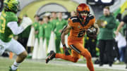 Oregon State Beavers wide receiver Anthony Gould (2) catches a pass during the second half against Oregon Ducks defensive back Evan Williams (33) at Autzen Stadium.