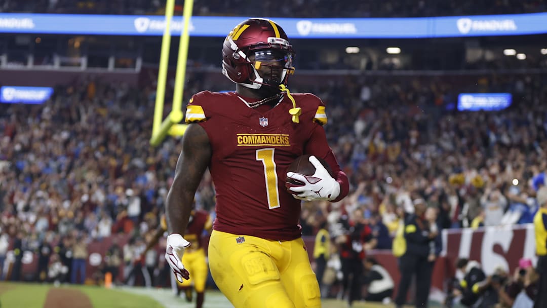  Washington Commanders wide receiver Deebo Samuel Sr. (1) reacts after scoring a touchdown during the third quarter against the Detroit Lions at Northwest Stadium. Mandatory Credit: Peter Casey-Imagn Images