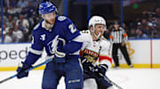 Apr 30, 2025; Tampa, Florida, USA; Florida Panthers left wing Matthew Tkachuk (19) and Tampa Bay Lightning center Brayden Point (21) skate  during the second period of game five of the first round of the 2025 Stanley Cup Playoffs at Amalie Arena. Mandatory Credit: Kim Klement Neitzel-Imagn Images