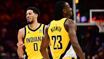 May 13, 2025; Cleveland, Ohio, USA; Indiana Pacers forward Aaron Nesmith (23) and guard Tyrese Haliburton (0) celebrate during the second half of game five against the Cleveland Cavaliers in the second round for the 2025 NBA Playoffs at Rocket Arena. Mandatory Credit: Ken Blaze-Imagn Images