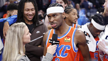 Dec 10, 2024; Oklahoma City, Oklahoma, USA; Oklahoma City Thunder guard Shai Gilgeous-Alexander (2) speaks to a tv reporter after his team defeated the Dallas Mavericks at Paycom Center. Mandatory Credit: Alonzo Adams-Imagn Images