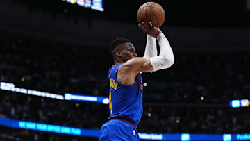 Apr 19, 2025; Denver, Colorado, USA; Denver Nuggets guard Russell Westbrook (4) lines up a three-point shot in the second half against the LA Clippers at Ball Arena. Mandatory Credit: Ron Chenoy-Imagn Images