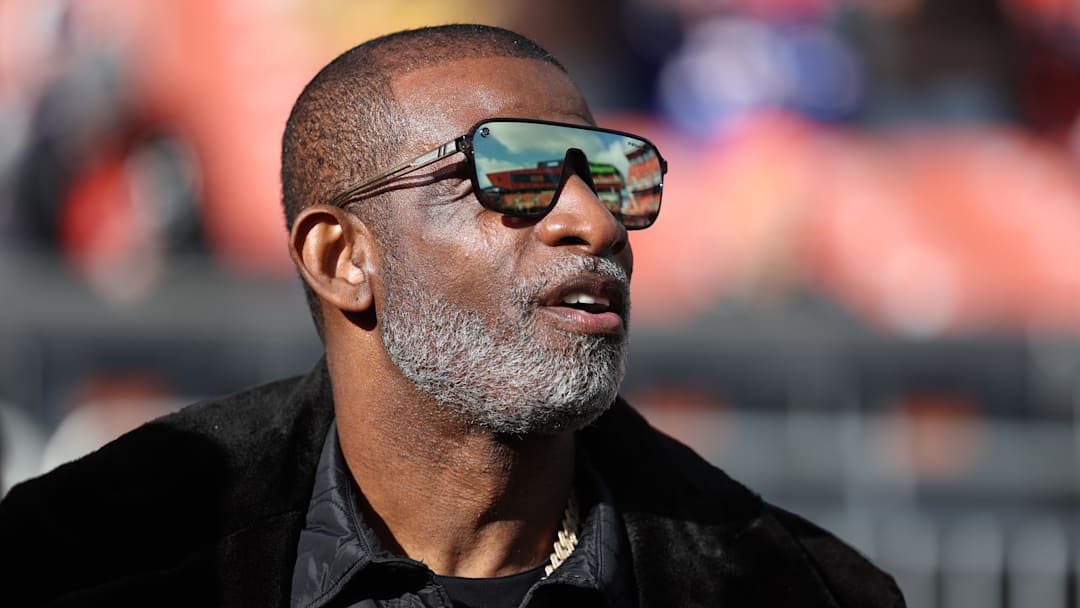 Dec 21, 2025; Cleveland, Ohio, USA;  Legendary  football and baseball player and father of Cleveland Browns quarterback Shedeur Sanders, Deion Sanders on the sidelines prior to a game against the Buffalo Bills at Huntington Bank Field. Mandatory Credit: Scott Galvin-Imagn Images