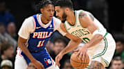 Boston Celtics forward Jayson Tatum (0) drives to the basket against Philadelphia 76ers guard Jeff Dowtin Jr.