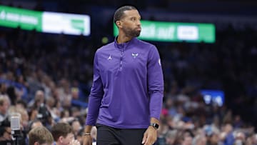 Mar 21, 2025; Oklahoma City, Oklahoma, USA; Charlotte Hornets head coach Charles Lee watches his team play against the Oklahoma City Thunder during the second half at Paycom Center. Mandatory Credit: Alonzo Adams-Imagn Images
