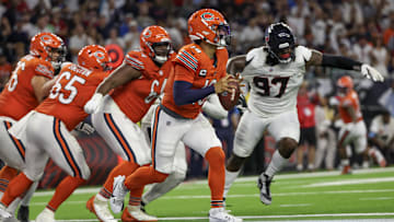 Caleb Williams tries to scramble away from Mario Edwards Jr. in the Bears' 19-13 loss to the Texans.