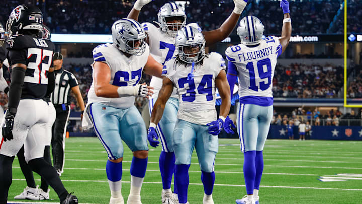 Teammates celebrate with Dallas Cowboys running back Jaydon Blue after he scores a touchdown against the Atlanta Falcons. Teammates celebrate with Dallas Cowboys running back Jaydon Blue after he scores a touchdown against the Atlanta Falcons.
