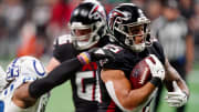 Dec 24, 2023; Atlanta, Georgia, USA; Atlanta Falcons running back Tyler Allgeier (25) carries the ball against the Indianapolis Colts during the fourth quarter at Mercedes-Benz Stadium. Mandatory Credit: John David Mercer-USA TODAY Sports