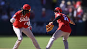Cincinnati Reds shortstop Elly De La Cruz (44) and center fielder Mike Siani (38) celebrate after defeating the Los Angeles Angels at Angel Stadium on Aug. 23, 2023.