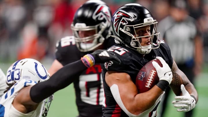 Dec 24, 2023; Atlanta, Georgia, USA; Atlanta Falcons running back Tyler Allgeier (25) carries the ball against the Indianapolis Colts during the fourth quarter at Mercedes-Benz Stadium. Mandatory Credit: John David Mercer-USA TODAY Sports