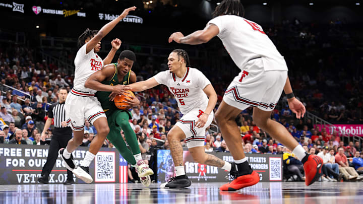 Mar 13, 2025; Kansas City, MO, USA; Baylor Bears guard VJ Edgecombe (7) drives to the basket around Texas Tech Red Raiders forward Darrion Williams (5) during the second half at T-Mobile Center. Mandatory Credit: William Purnell-Imagn Images
