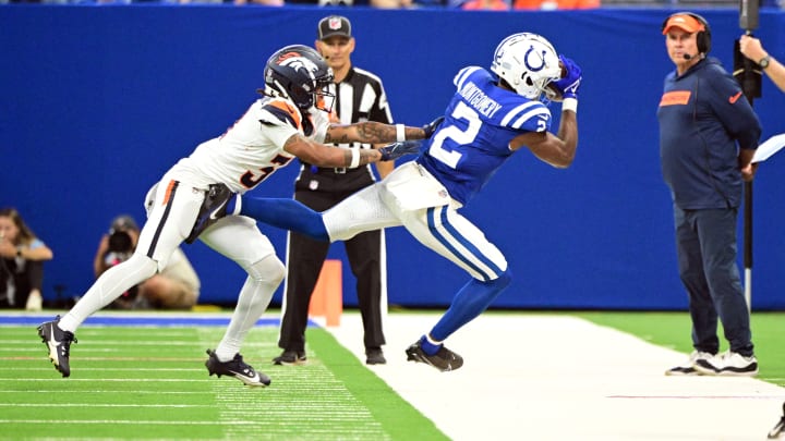 Indianapolis Colts wide receiver D.J. Montgomery (2) catches a pass in front of Denver Broncos cornerback Kris Abrams-Draine (31) during the second half at Lucas Oil Stadium.