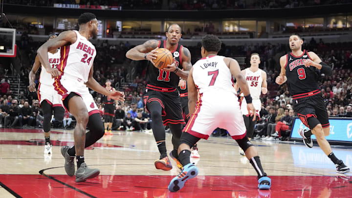 Nov 18, 2023; Chicago, Illinois, USA; Miami Heat guard Kyle Lowry (7) defends Chicago Bulls forward DeMar DeRozan (11) during the first half at United Center. Mandatory Credit: David Banks-Imagn Images