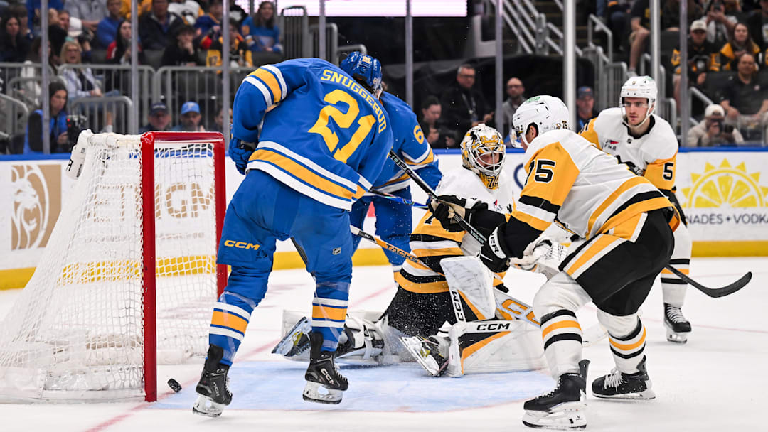 Apr 14, 2026; St. Louis, Missouri, USA; St. Louis Blues right wing Jimmy Snuggerud (21) scores against the Pittsburgh Penguins during the second period at Enterprise Center. Mandatory Credit: Connor Hamilton-Imagn Images