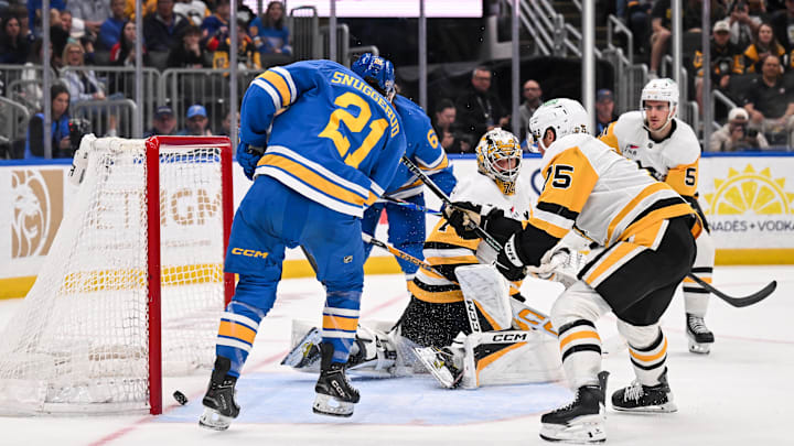 Apr 14, 2026; St. Louis, Missouri, USA; St. Louis Blues right wing Jimmy Snuggerud (21) scores against the Pittsburgh Penguins during the second period at Enterprise Center. Mandatory Credit: Connor Hamilton-Imagn Images