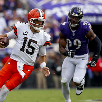 Sep 14, 2025; Baltimore, Maryland, USA; Cleveland Browns quarterback Joe Flacco (15) runs the ball against Baltimore Ravens linebacker Odafe Oweh (99) during the third quarter at M&T Bank Stadium. Mandatory Credit: Peter Casey-Imagn Images
