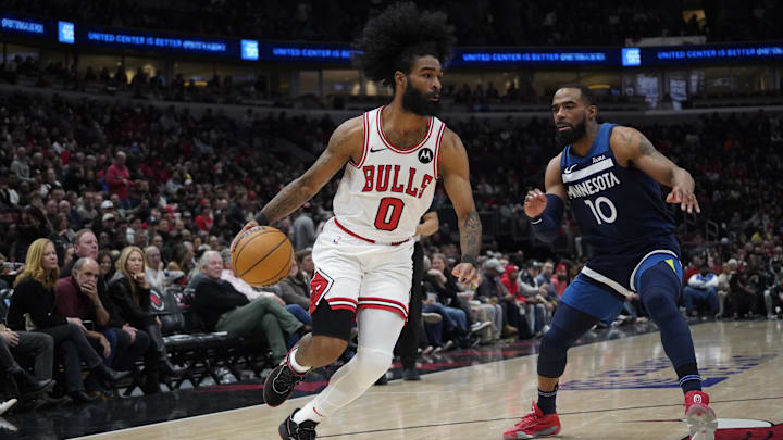 Feb 6, 2024; Chicago, Illinois, USA; Minnesota Timberwolves guard Mike Conley (10) defends Chicago Bulls guard Coby White (0) during the first quarter at United Center. Mandatory Credit: David Banks-Imagn Images