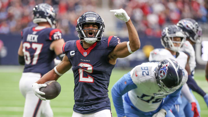 Dec 31, 2023; Houston, Texas, USA; Houston Texans wide receiver Robert Woods (2) celebrates his first down run against the Tennessee Titans in the first quarter at NRG Stadium. Mandatory Credit: Thomas Shea-USA TODAY Sports