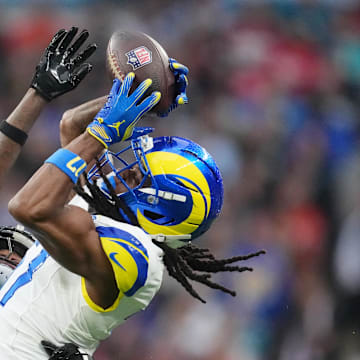 Oct 19, 2025; London, United Kingdom; Los Angeles Rams wide receiver Davante Adams (17) makes a catch against Jacksonville Jaguars wide receiver Travis Hunter (12) during the second half of an NFL International Series game at Wembley Stadium. Mandatory Credit: Kirby Lee-Imagn Images