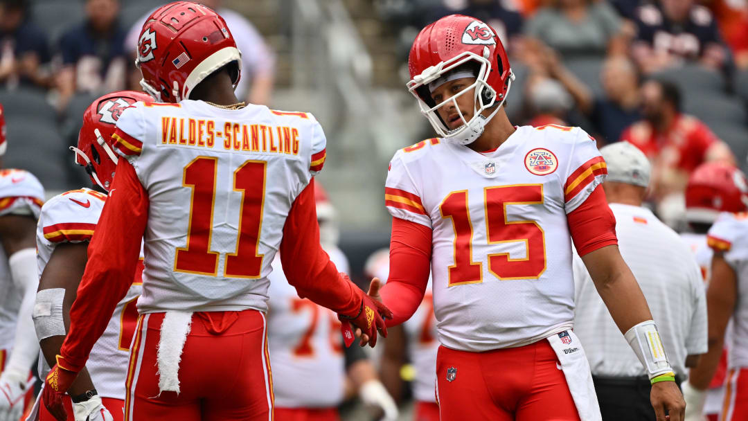 Aug 13, 2022; Chicago, Illinois, USA;  Kansas City Chiefs quarterback Patrick Mahomes (15) warms up with wide receiver Marquez Valdes-Scantling (11) before a game against the Chicago Bears at Soldier Field. Mandatory Credit: Jamie Sabau-USA TODAY Sports