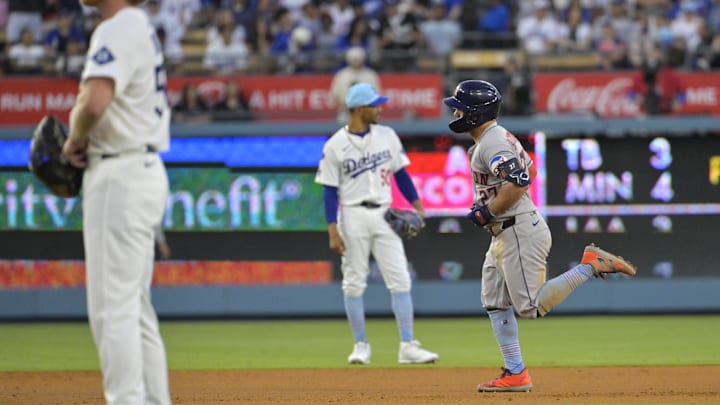 Jose Altuve rounds the bases after mashing a three-run home run in the sixth inning of the Astros' 18-1 win over the Dodgers.