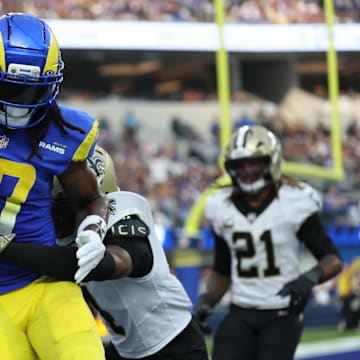 Nov 2, 2025; Inglewood, California, USA; Los Angeles Rams wide receiver Davante Adams (17) makes a touchdown catch in front of New Orleans Saints cornerback Kool-Aid McKinstry (4) during the second half at SoFi Stadium. Mandatory Credit: Kiyoshi Mio-Imagn Images