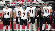 Oct 19, 2025; Santa Clara, California, USA; Atlanta Falcons running back Bijan Robinson (7) stands on the sideline with wide receiver Drake London (center left) and center Ryan Neuzil (64) and offensive tackles Elijah Wilkinson (71) and Jake Matthews (70) before the game against the San Francisco 49ers at Levi's Stadium. Mandatory Credit: Darren Yamashita-Imagn Images
