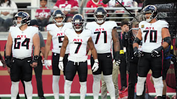 Oct 19, 2025; Santa Clara, California, USA; Atlanta Falcons running back Bijan Robinson (7) stands on the sideline with wide receiver Drake London (center left) and center Ryan Neuzil (64) and offensive tackles Elijah Wilkinson (71) and Jake Matthews (70) before the game against the San Francisco 49ers at Levi's Stadium. Mandatory Credit: Darren Yamashita-Imagn Images