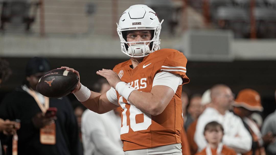 Texas Longhorns quarterback Arch Manning warms up before a game against the Texas A&M Aggies
