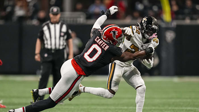 Nov 26, 2023; Atlanta, Georgia, USA; Atlanta Falcons linebacker Lorenzo Carter (0) tries to tackle
