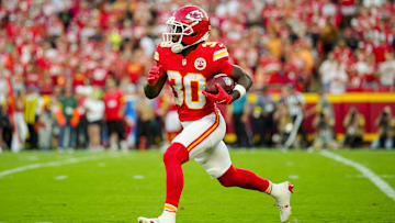 Aug 22, 2025; Kansas City, Missouri, USA; Kansas City Chiefs running back Brashard Smith (30) returns a kickoff during the first half against the Chicago Bears at GEHA Field at Arrowhead Stadium. Mandatory Credit: Jay Biggerstaff-Imagn Images