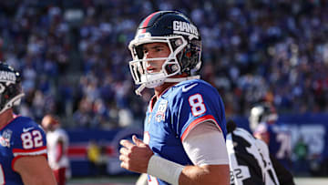 Nov 3, 2024; East Rutherford, New Jersey, USA; New York Giants quarterback Daniel Jones (8) runs of fetch field after throwing a touchdown pass during the first half against the Washington Commanders at MetLife Stadium. Mandatory Credit: Vincent Carchietta-Imagn Images